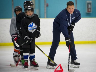 NHL players Kevin Bieksa and Jason Garrison, two former Canucks defencemen assist in hockey school program in Richmond, where they also train the upcoming season.    Mark van Manen/ PNG