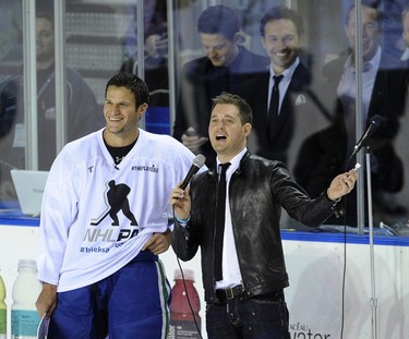 Thrill of the night for Canucks player Kevin Bieksa with pal  Michael Buble (r) during the Bieksa's Buddie Charity hockey game  at the U.B.C. Thunderbird area. All proceeds from the sold out game will benefit Canuck Place Children's Hospice, Canucks Family Education Centre, and Canucks Autism Networkon in Vancouver on   October 17, 2012