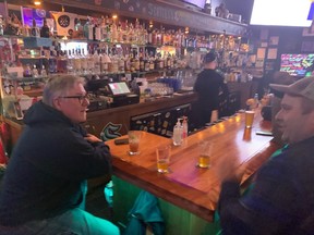 Tim Pipes (left) owns the Angry Beaver in north Seattle. Pipes is originally from Ontario and the Angry Beaver is Canadian and hockey-theme based. The bar recently celebrated its 10th anniversary.