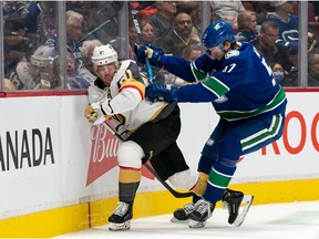 Tyler Myers of the Vancouver Canucks checks Jonathan Marchessault of the Las Vegas Golden Knights in April 2022.