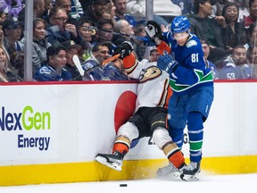 Canucks winger Dakota Joshua unloads on Ducks forward Frank Vatrano during Nov. 3 game at Rogers Arena.