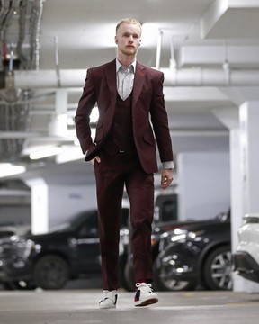 Elias Pettersson of the Vancouver Canucks walks to the Canucks dressing room before their game against the Vegas Golden Knights at Rogers Arena on Nov. 21, 2022.