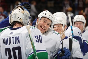 Andrei Kuzmenko and goaltender Spencer Martin of the Vancouver Canucks celebrate the victory against the Colorado Avalanche at Ball Arena on Nov. 23, 2022 in Denver, Colorado.