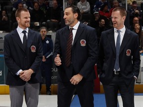 Hockey Hall of Fame inductees honored ahead of the HHoF Legends Classic game on November 13, 2022 include (from left) Daniel Sedin, Roberto Luongo and Henrik Sedin.