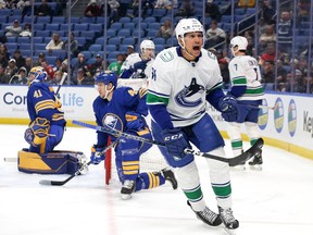 Dakota Joshua of the Vancouver Canucks celebrates his goal during the first period of an NHL hockey game against the Buffalo Sabers at KeyBank Center on November 15, 2022 in Buffalo, New York.