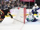 Spencer Martin and Luke Schenn of the Vancouver Canucks defend against Keegan Kolesar of the Vegas Golden Knights in the second period of their game at T-Mobile Arena on November 26, 2022 in Las Vegas, Nevada.