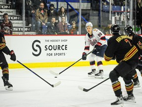 Connor Bedard of the Regina Pats surveys the Vancouver Giants defensive structure in Friday's WHL games at the Langley Events Centre.