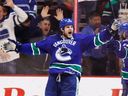 Kevin Bieksa, celebrating his game-winning overtime goal against the Phoenix Coyotes in a January 2014 NHL game at Rogers Arena, always looked at what he could do to change momentum in any game.
