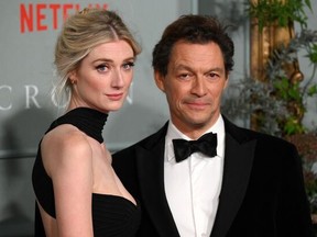 Australian actor Elizabeth Debicki (left) and English actor Dominic West pose on the red carpet upon arrival to attend the World Premiere of "The Crown (Season 5)" in London on Nov. 8, 2022.