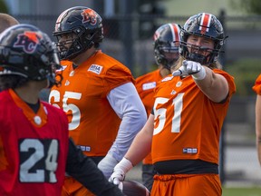 Peter Godber, left, and Sukh Chung, No. 65, were two B.C. Lions named to the West Division all-star team on Wednesday. That is, until a recount saw both of them struck from the all-star roster.