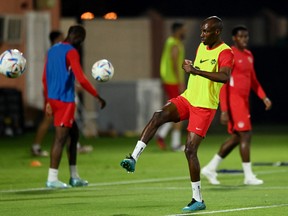 Canada's Atiba Hutchinson runs through drills on Tuesday at the Umm Salal SC Training Facilities ahead of their World Cup opener against Belgium in Qatar on Wednesday. Hutchinson, 39, was three years old when Canada last played in the World Cup.