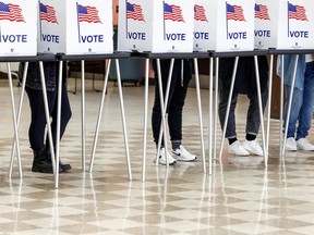 Voters cast their ballots at Northern High School in the midterm election, in Detroit, Mich, Nov. 8, 2022.