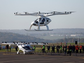 A Volocopter 2X drone taxi performs an integrated flight in conventional air traffic at Pontoise airfield in Cormeilles-en-Vexin, near Paris, Nov. 10, 2022.