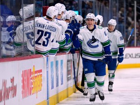Vancouver Canucks winger Ilya Mikheyev is congratulated after scoring against the Avalanche on Nov. 23 in Denver.