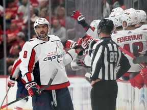 Washington Capitals left wing Alex Ovechkin greets teammates after scoring during the second period of an NHL hockey game against the Detroit Red Wings, Thursday, Nov. 3, 2022, in Detroit.