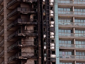 A picture shows the fire damage on a tower in downtown Dubai on Nov. 6, 2022, after a fire spread throughout the high-rise in the early hours of the morning.