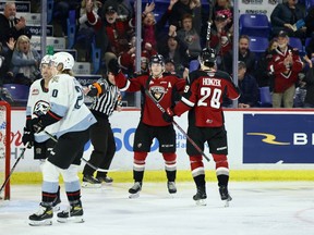 Vancouver Giants forward Ty Thorpe celebrates his goal with linemate Samuel Honzek during a Nov. 27 WHL game against the Portland Winterhawks at the Langley Events Centre.