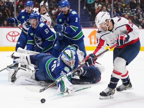 Vancouver Canucks goalkeeper Spencer Martin, 30, lost his stick in the second period after stopping Washington Capitals' Nick Dowd, 26.