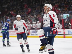 Washington Capitals' Alex Ovechkin celebrates his first goal against the Vancouver Canucks in the first period on Tuesday night.