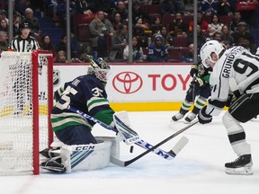 Vancouver Canucks goaltender Thatcher Demko, 35, stops Karl Grandstrom, 91, of the Sweden's Los Angeles Kings in the second period of an NHL hockey game in Vancouver on Friday, November 18, 2022.