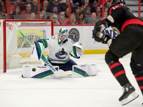 November 8, 2022: Vancouver Canucks goalkeeper Spencer Martin (30) saves a shot off left fielder Austin Watson (16) of the Ottawa Senators in the first period at the Canadian Tire Centre.