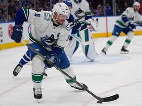 Vancouver Canucks forward JT Miller, 9, carries the puck in the first period against the Toronto Maple Leafs at Scotiabank Arena on November 12, 2022.