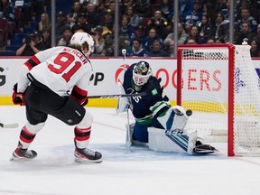 New Jersey Devils forward Dawson Mercer (91) scores on Vancouver Canucks goalie Thatcher Demko (35) in the second period at Rogers Arena on Nov. 1, 2022.