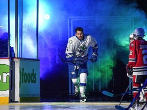 Abbotsford Canucks defenceman Jett Woo steps onto the ice at the Abbotsford Centre earlier this season.