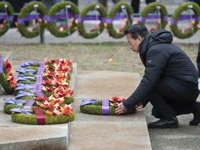 Annual Remembrance Day ceremony at Victory Square in Vancouver, BC Friday, November 11, 2022. This year was the 98th service held at Victory Square and was attended by hundreds of veterans, their families and the public to pay respects to those who have worn the uniform in service of their country. Pictured is Vancouver mayor Ken Sim laying a wreath.