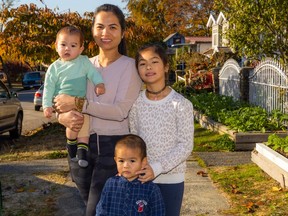 Part of the Nguyen family. Mom Trinh, toddler Justin, infant Lincoln and daughter Anna.