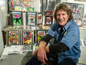 Ron Trayling with some of his comic books.
