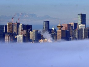 Early morning fog covers downtown Vancouver.