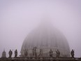 A photograph shows St Peter's Basilica under fog in the Vatican on November 17, 2022.