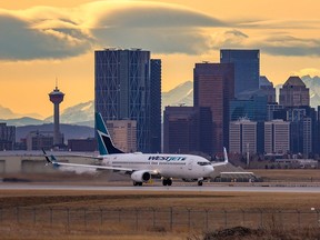 A WestJet Boeing 737 takes off from the Calgary International Airport on Nov. 18, 2021.