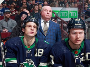Bruce Boudreau looks onto the ice during the first period of the Canucks NHL game against the Minnesota Wild at Rogers Arena Dec. 10, 2022 in Vancouver.