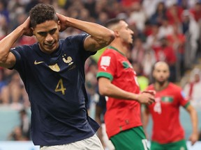 France's defender Raphael Varane reacts to a missed chance.