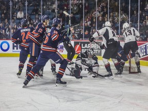 Jesper Vikman makes a save for the Vancouver Giants while the Kamloops Blazers drive to the net. The Blazer won 3-0 Friday in Kamloops.