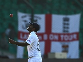 England's Rehan Ahmed tosses a ball while celebrating after all out of Pakistan in the second inning during the third day of the third cricket Test match between Pakistan and England at the National Stadium in Karachi on Dec. 19, 2022.