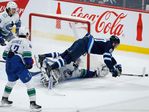 Dube scores 2, Lindholm gets 40th as Flames beat Canucks 6-3 - The San  Diego Union-Tribune