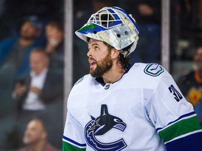 Canucks goalie Spencer Martin during a break in their National Hockey League game in Calgary against the Flames on Dec. 14, 2022.