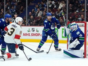 Vancouver Canucks goaltender Spencer Martin (30) blocks a shot during the second period against the Florida Panthers at Rogers Arena Dec. 1, 2022.