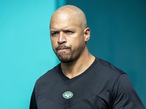 New York Jets wide receivers coach Miles Austin walks onto the field before an NFL game against the Miami Dolphins, Dec. 19, 2021, in Miami Gardens, Fla.