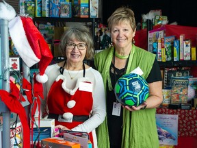 Langley Christmas Toy Bureau coordinator Patty Lester and toy coordinator Barbara Kennett with toys that will be distributed this year to clients, at the Timms Community Centre in Langley.