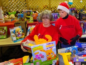 Tina Kirkpatrick (left) and Sheila Dodgshon prepare toys at the Maple Ridge-Pitt Meadows Christmas Hamper Society.