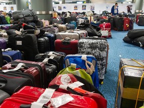 Hundreds of pieces of unclaimed luggage that need to be reunited with their owners sit at YVR on Thursday.