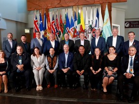 Premiers (back row L-R), Sandy Silver (Yukon), P.J. Akeeagok, (Nunavut), Scott Moe (SK), Doug Ford (Ont),Francois Legault (Que), Dennis King (PEI), Tim Houston (NS), Blaine Higgs (NB), Andrew Furey (NL and Labrador) and (front row L-R), President of Institute for the advancement of Aboriginal Women Lisa Weber, National Chief of Congress of Aboriginal Peoples Elmer St. Pierre, Heather Stefanson (MB), Songhees Nation Chief Ron Sam, John Horgan (BC), Esquimalt Nation Chief Rob Thomas, Caroline Cochrane (NWT), Cassidy Caron (Metis National Council) and Terry Teegee (Assembly of First Nations) gather for a family photo during the summer meeting of the Canada's Premiers at the Songhees Wellness Centre in Victoria, B.C., July 11, 2022.