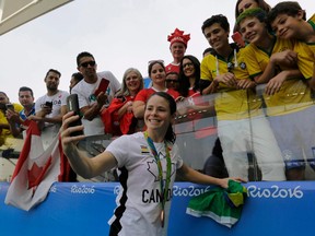 Diana Matheson, getting a selfie with fans at after a bronze-medal performance for Canada at the 2016 Summer Olympics in Brazil, is helping lead the push for the national women’s soccer league.