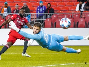 Toronto FC forward Jozy Altidore (17) scores a goal against Pacific FC goalkeeper Callum Irving (13) during first half Canadian Championship semifinal action in Toronto on Wednesday, November 3, 2021.