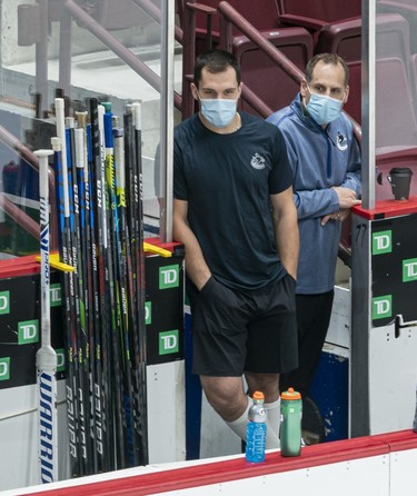 Bo Horvat #53 of the Vancouver Canucks watches the first group of players during their session on the first day of the Vancouver Canucks NHL Training Camp at Rogers Arena on January 4, 2021 in Vancouver, British Columbia, Canada.