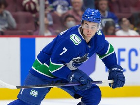 Vancouver Canucks winger Will Lockwood skates up the ice during a preseason NHL game agains the Calgary Flames.